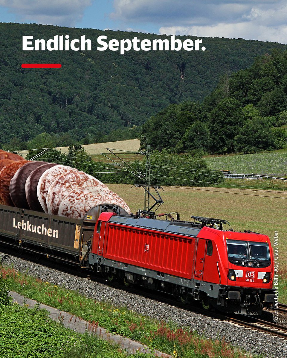 Auf dem Bild ist ein Güterzug zu sehen, der überdimensionale Lebkuchen geladen hat. Auf dem Bild steht: "Endlich September."